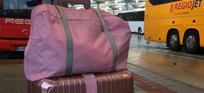 solo travel pink luggage